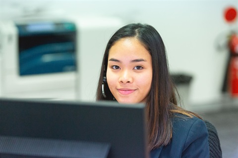 person sitting at computer