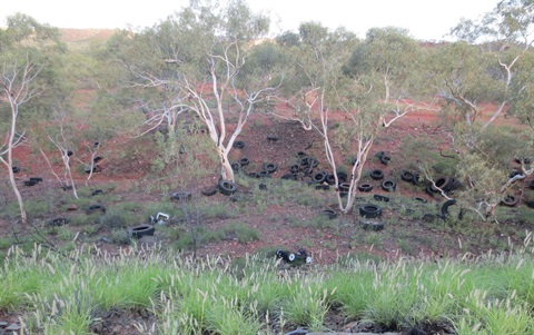 Scores of tyres recently illegally dumped in bushland on Mount Isa’s outskirts.